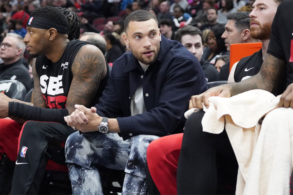 Chicago Bulls guard Zach LaVine (8) sits on the bench in street clothes during the first quarter at United Center. 