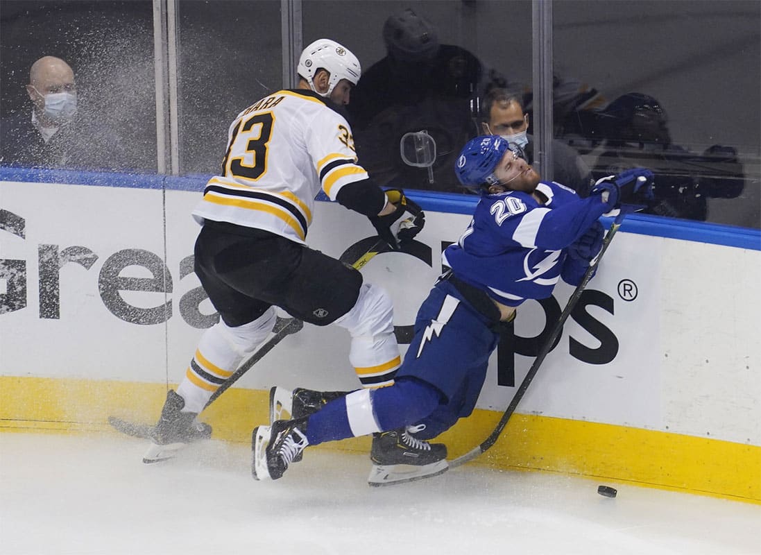 Tampa Bay Lightning center Blake Coleman (20) is checked by Boston Bruins defenseman Zdeno Chara (33) during the first period in game one of the second round of the 2020 Stanley Cup Playoffs at Scotiabank Arena