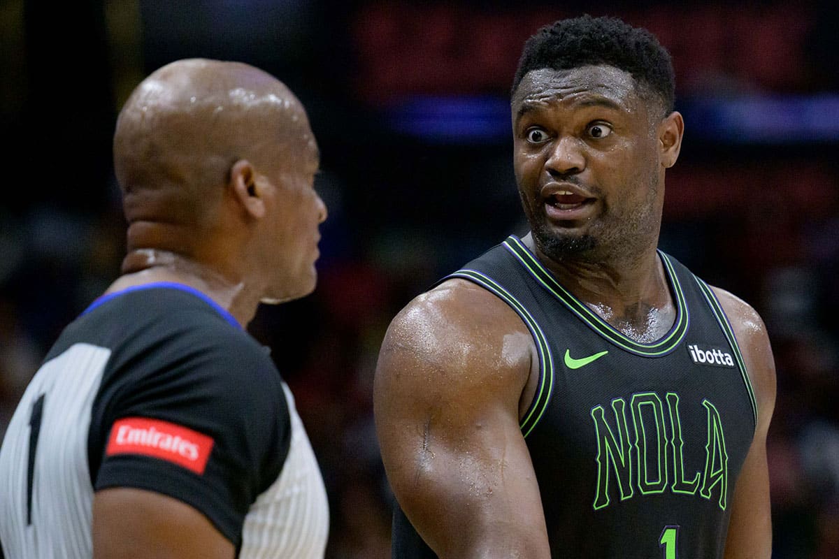 New Orleans Pelicans forward Zion Williamson (1) reacts to a call with referee Derrick Collins (11) at Smoothie King Center.