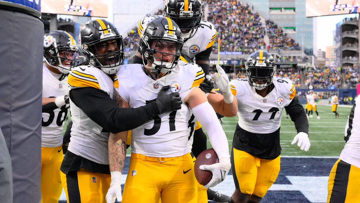 Dec 31, 2023; Seattle, Washington, USA; Pittsburgh Steelers linebacker Markus Golden (44) and linebacker Nick Herbig (51) and cornerback Joey Porter Jr. (24) celebrate after Herbig recovered a fumble against the Seattle Seahawks during the second half at Lumen Field. Mandatory Credit: Steven Bisig-USA TODAY Sports