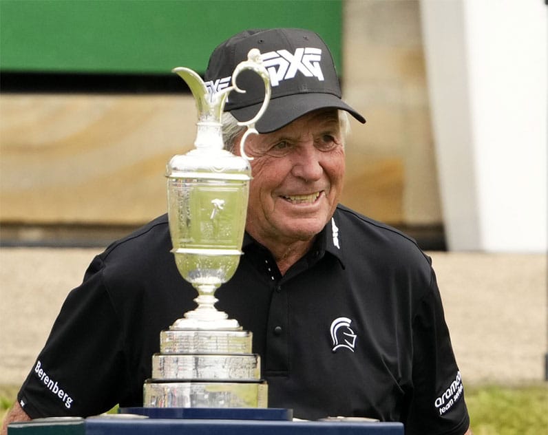 Gary Player poses with the Claret Jug on the first hole during the R&A Celebration of Champions four-hole challenge at the 150th Open Championship golf tournament at St. Andrews Old Course