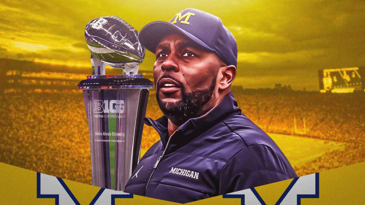 Michigan football, Wolverines, Michigan football predictions, 2024 Michigan football, Big Ten Media Days, Sherrone Moore and Big Ten football trophy with Michigan football stadium in the background