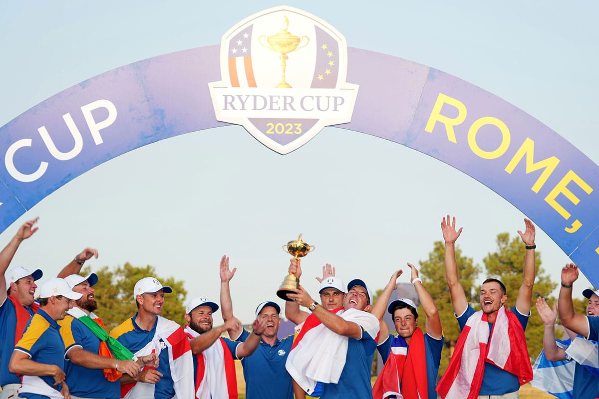  Team Europe golfer Rory McIlroy and Team Europe celebrates with the Ryder Cup after beating Team USA during the final day of the 44th Ryder Cup golf competition at Marco Simone Golf and Country Club.