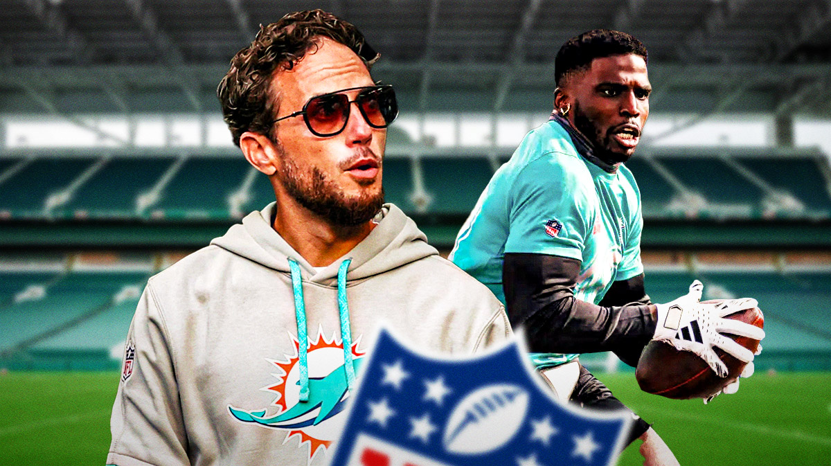 Dolphins Mike McDaniel on left looking serious. Dolphins Tyreek Hill on right catching a football.