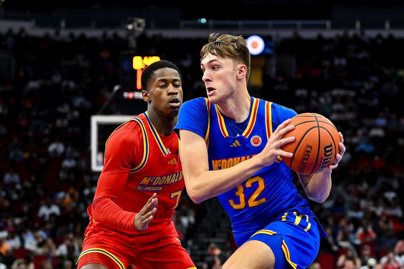 McDonald's All American East forward Cooper Flagg (32) controls the ball as McDonald's All American West guard Valdez Edgecombe Jr (7) defends during the first half at Toyota Center.