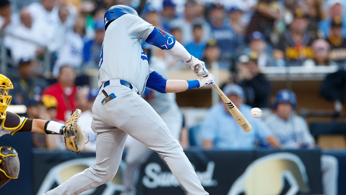 Los Angeles Dodgers second baseman Gavin Lux (9) hits a sacrifice fly during the first inning against the San Diego Padres at Petco Park.