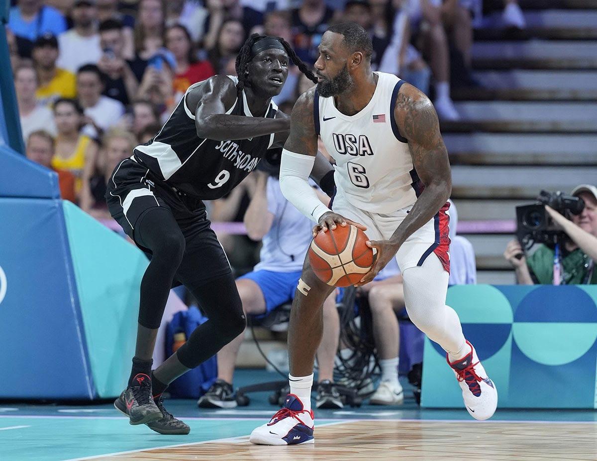 United States guard Lebron James (6) dribbles against South Sudan power forward Wenyen Gabriel (9) in the second quarter during the Paris 2024 Olympic Summer Games at Stade Pierre-Mauroy.