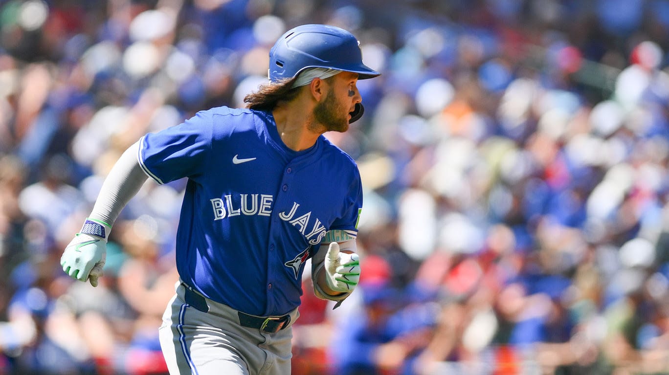 Toronto Blue Jays shortstop Bo Bichette (11) runs towards first base after hitting a single against the Seattle Mariners during the seventh inning at T-Mobile Park.