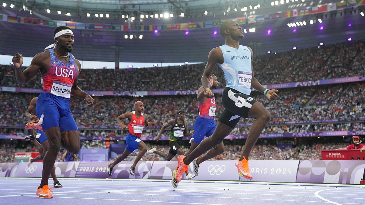 Letsile Tebogo (BOT) defeats Kenneth Bednarek (USA) and Noah Lyles (USA) to win the men's 200m final during the Paris 2024 Olympic Summer Games at Stade de France.