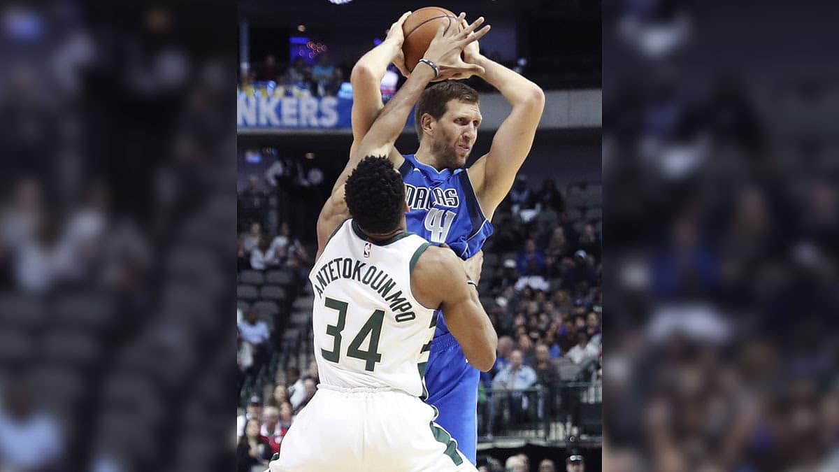 Dallas Mavericks forward Dirk Nowitzki (41) looks to pass as Milwaukee Bucks forward Giannis Antetokounmpo (34) defends during the first quarter at American Airlines Center.