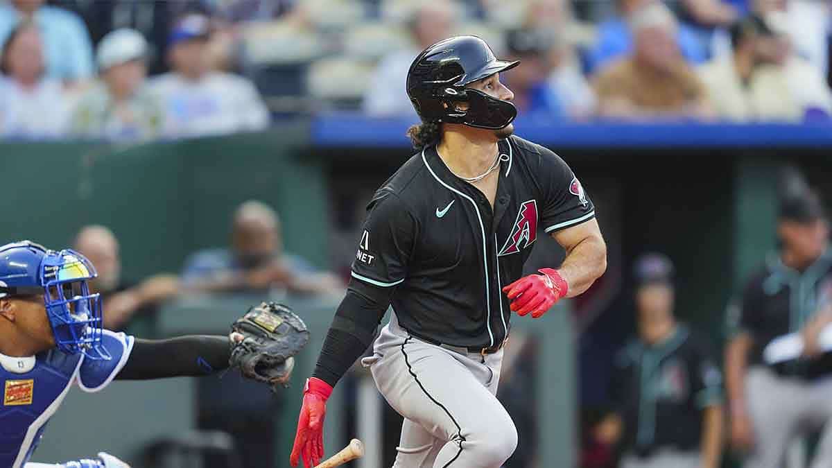 Arizona Diamondbacks center fielder Alek Thomas (5) hits an RBI double against the Kansas City Royals during the third inning at Kauffman Stadium.