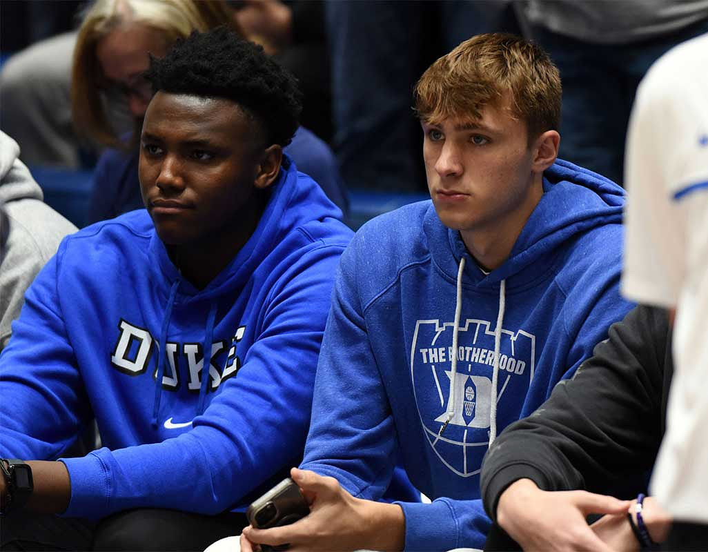 Duke Blue Devils commits Patrick Ngongba (left) and Cooper Flagg look on prior to a game against the North Carolina Tar Heels at Cameron Indoor Stadium.