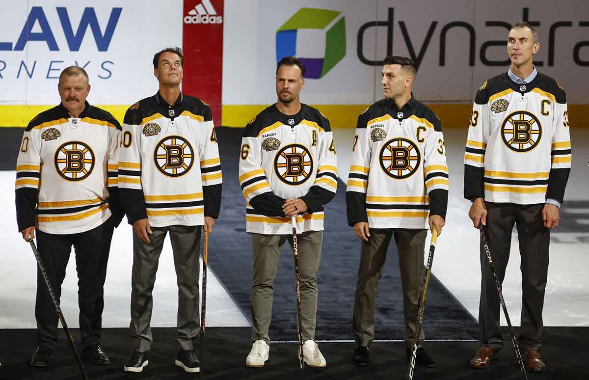 Members of the Boston Bruins 2011 Stanley Cup championship team, from left, Tim Thomas, Tuukka Rask, David Krejci, Patrice Bergeron and Zdeno Chara before the start of Boston s 100th season in the NHL at TD Garden.