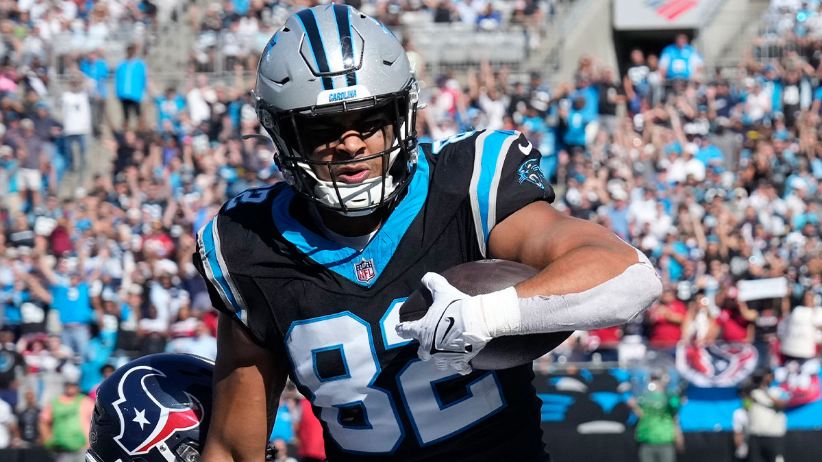 Carolina Panthers tight end Tommy Tremble (82) scores a touchdown as Houston Texans linebacker Blake Cashman (53) defends in the second quarter at Bank of America Stadium.