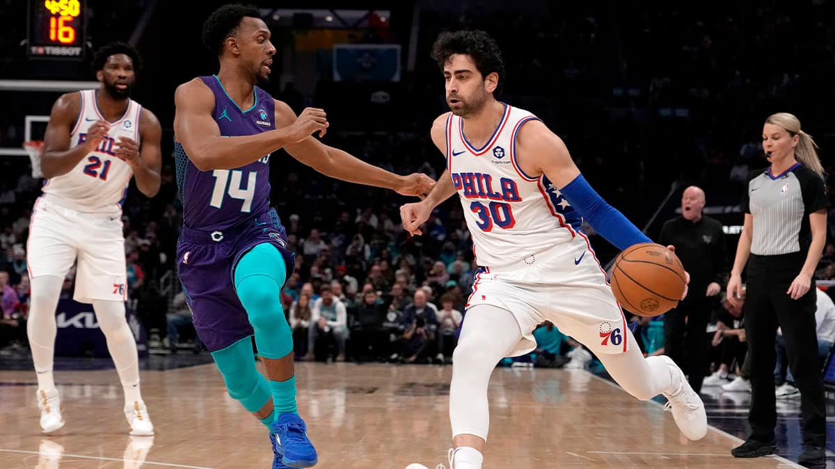 Philadelphia 76ers guard Furkan Korkmaz (30) handles the ball guarded by Charlotte Hornets guard Ish Smith (14)