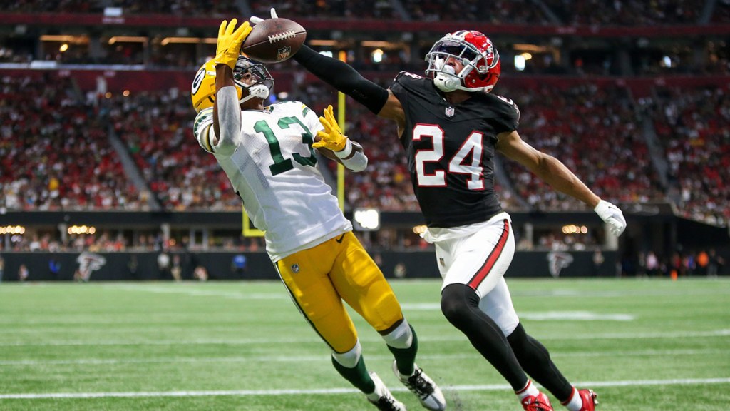 Atlanta Falcons cornerback A.J. Terrell (24) breaks up a pass intended for Green Bay Packers wide receiver Dontayvion Wicks (13) in the second quarter at Mercedes-Benz Stadium.