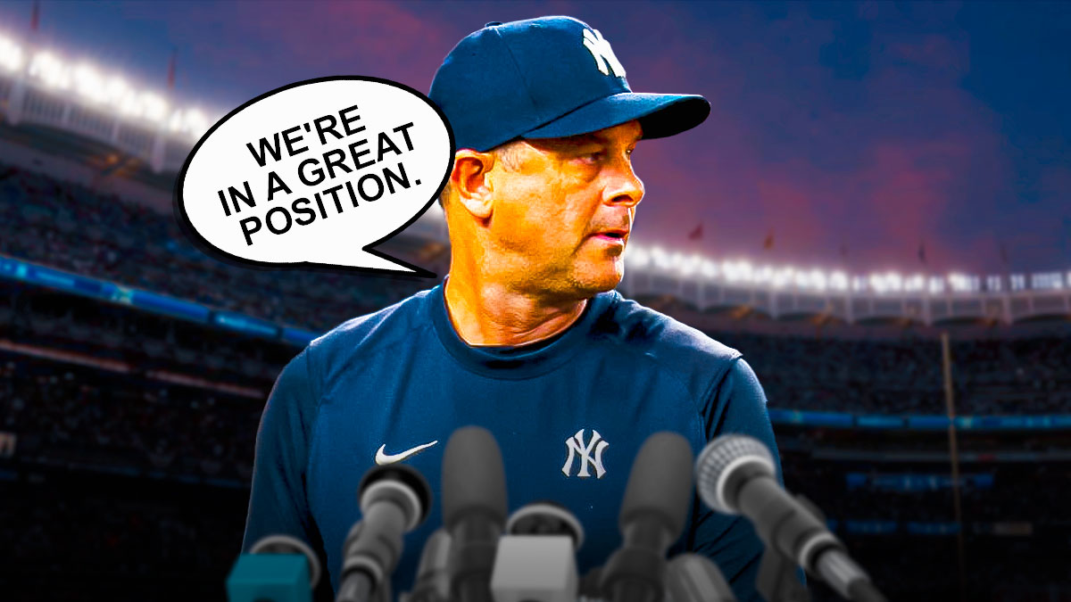 New York Yankees manager Aaron Boone in a press conference, with a thought bubble saying "We're in a great position."
