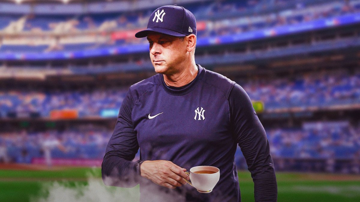 Aaron Boone sips tea in Yankees gear