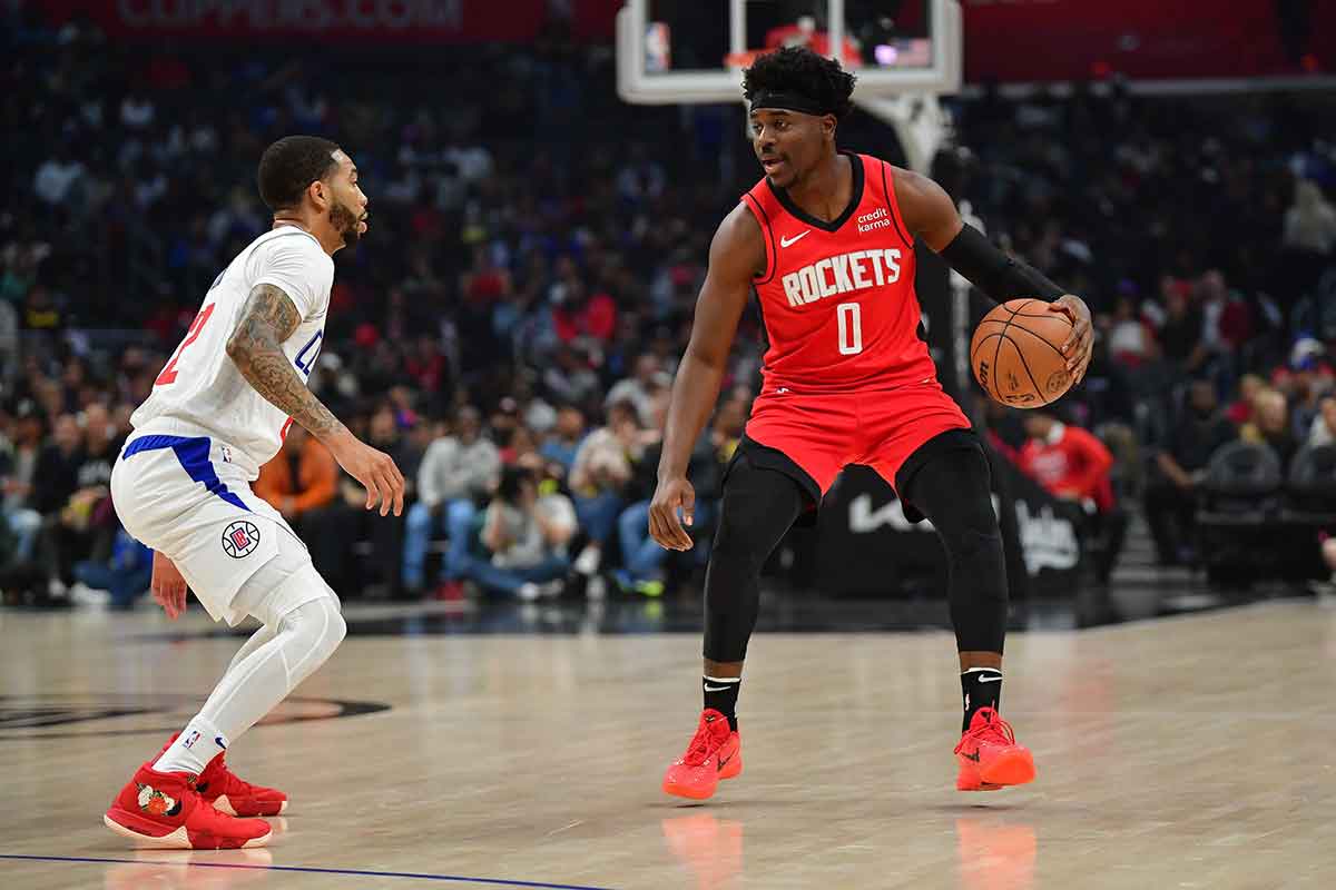 Houston Rockets guard Aaron Holiday (0) moves the ball against Los Angeles Clippers guard Xavier Moon (22) during the first half at Crypto.com Arena.