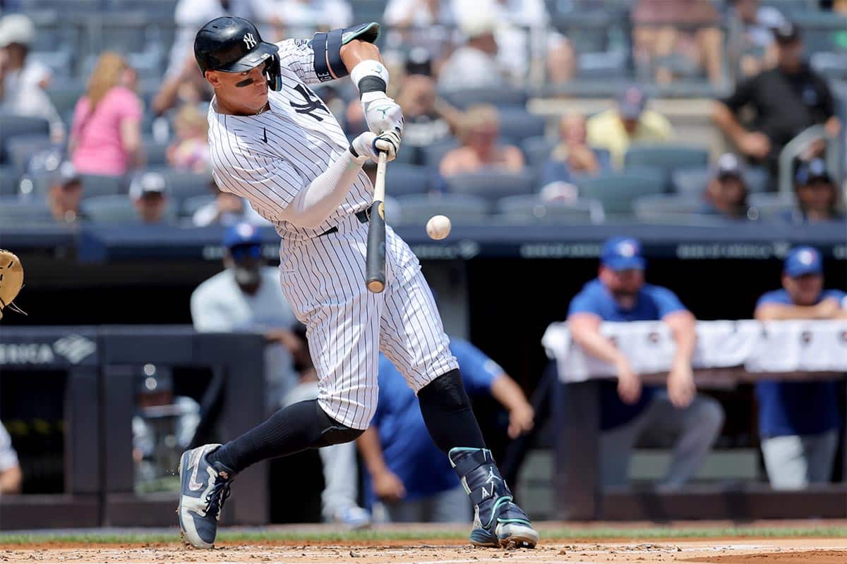 New York Yankees designated hitter Aaron Judge (99) hits a two run home run against the Toronto Blue Jays during the first inning at Yankee Stadium.