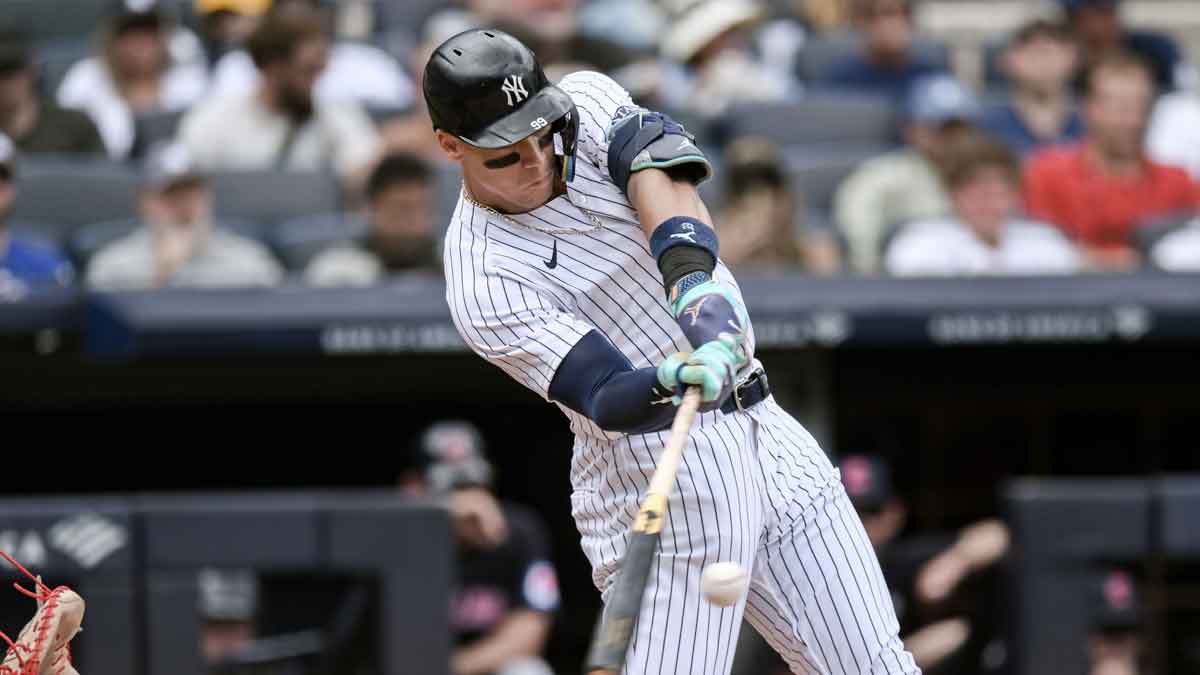 New York Yankees outfielder Aaron Judge (99) hits a solo home run against the Cleveland Guardians during the fourth inning at Yankee Stadium.