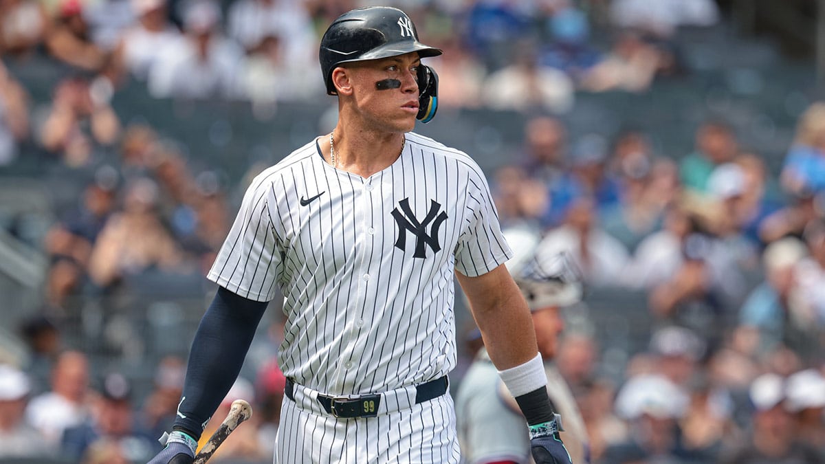 New York Yankees left fielder Aaron Judge (99) looks up after being intentionally walked during the fifth inning against the Toronto Blue Jays at Yankee Stadium.