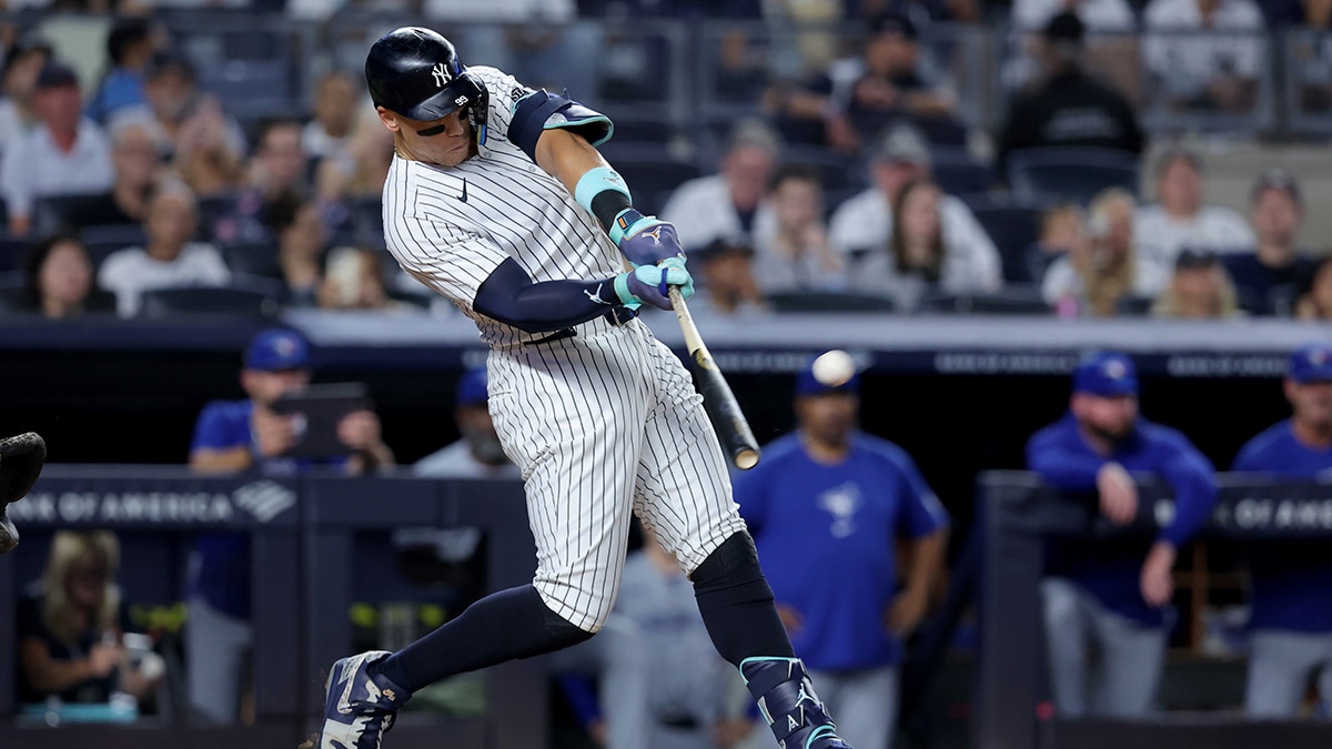 Aug 2, 2024; Bronx, New York, USA; New York Yankees center fielder Aaron Judge (99) hits a two run home run against the Toronto Blue Jays during the first inning at Yankee Stadium. 