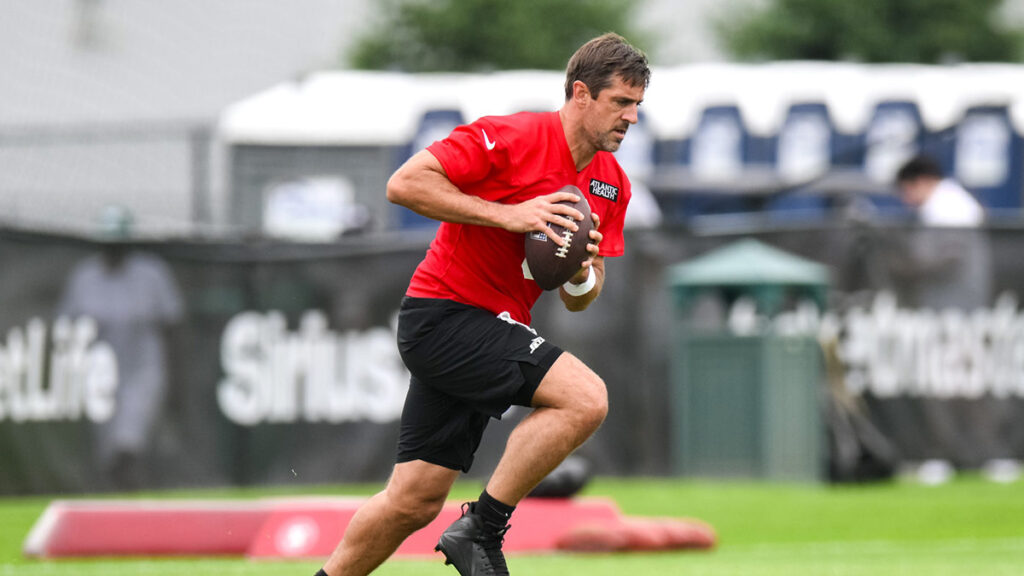 New York Jets quarterback Aaron Rodgers (8) participates in a drill during training camp at Atlantic Health Jets Training Center. 
