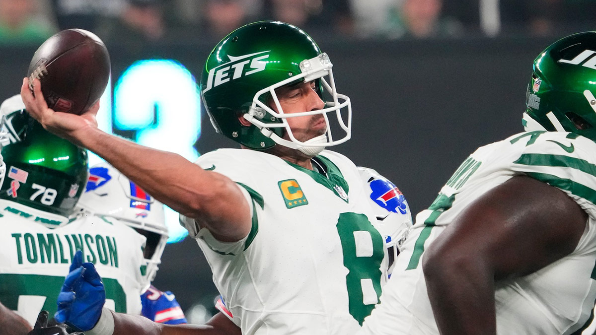 New York Jets quarterback Aaron Rodgers (8) throws under pressure against the Bills during the first half at MetLife Stadium.