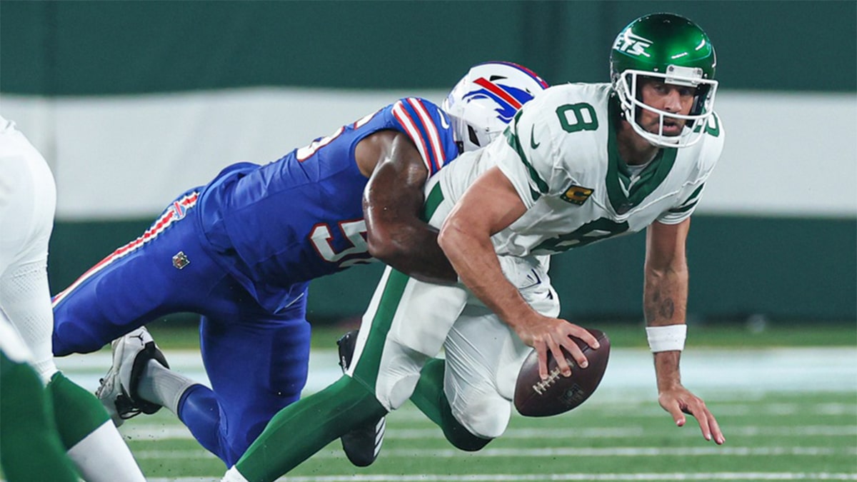 New York Jets quarterback Aaron Rodgers (8) is injured while being sacked by Buffalo Bills defensive end Leonard Floyd (56) during the first half at MetLife Stadium. 