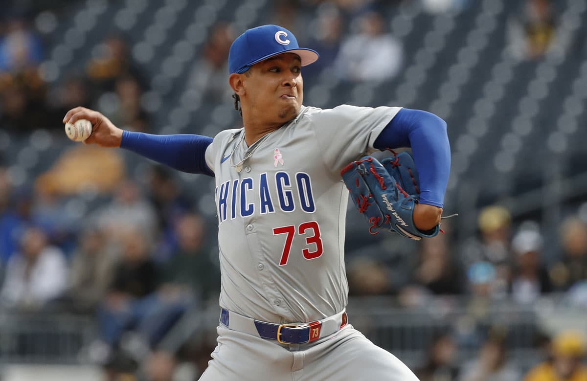 Chicago Cubs relief pitcher Adbert Alzolay (73) pitches against the Pittsburgh Pirates during the tenth inning at PNC Park. The Cubs won 5-4 in ten innings.