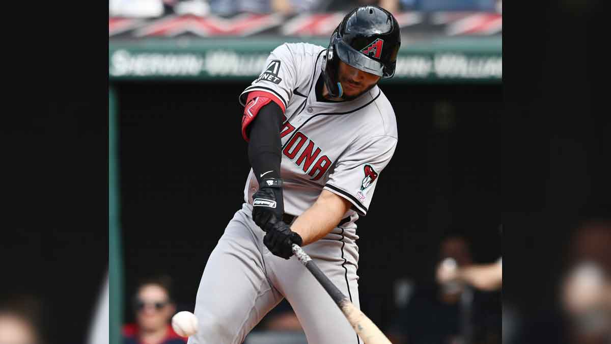 Aug 7, 2024; Cleveland, Ohio, USA; Arizona Diamondbacks catcher Adrian Del Castillo (25) hits an RBI double during the second inning against the Cleveland Guardians at Progressive Field. 