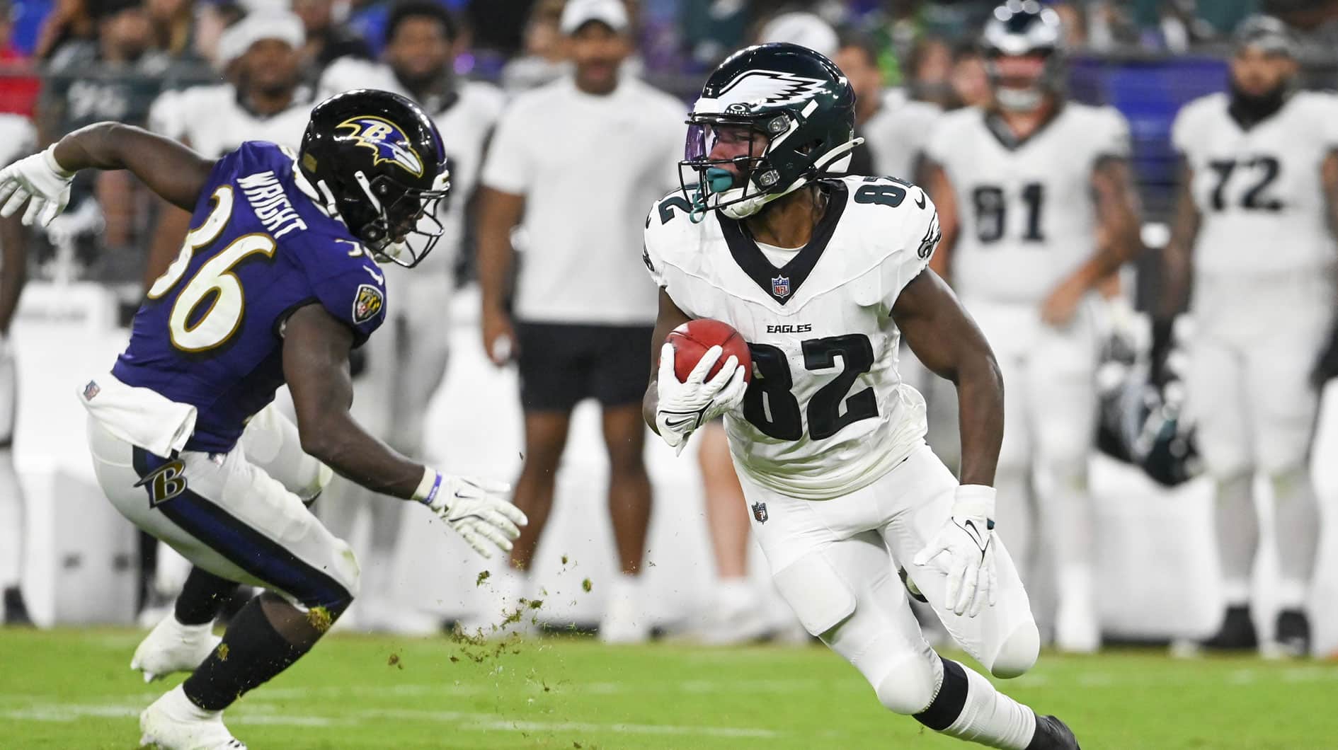 Philadelphia Eagles wide receiver Ainias Smith (82) returns a punt as Baltimore Ravens running back Owen Wright (36) defends during the second half of a preseason game at M&T Bank Stadium.