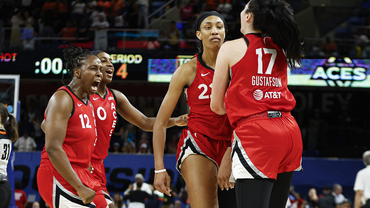 Las Vegas Aces center A'ja Wilson (22) celebrates with teammates after scoring game winning basket against the Chicago Sky during the second half at Wintrust Arena.