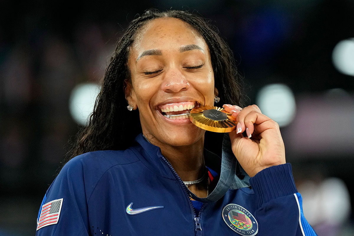 United States forward A'Ja Wilson (9) celebrates with the gold medal after defeating France in the women's gold medal game during the Paris 2024 Olympic Summer Games.