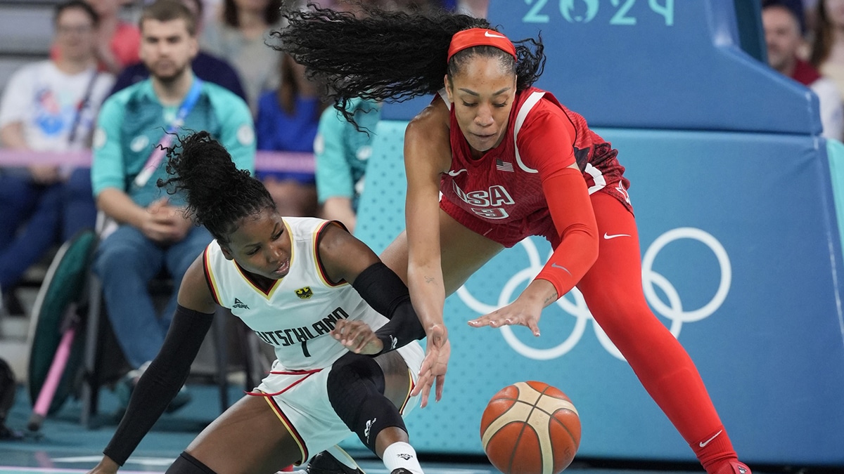 Aug 4, 2024; Villeneuve-d'Ascq, France; United States forward A'Ja Wilson (9) and Germany point guard Alexis Peterson (1) fight for a loose ball in the first half in a women’s group C game during the Paris 2024 Olympic Summer Games at Stade Pierre-Mauroy. Mandatory Credit: John David Mercer-USA TODAY Sports