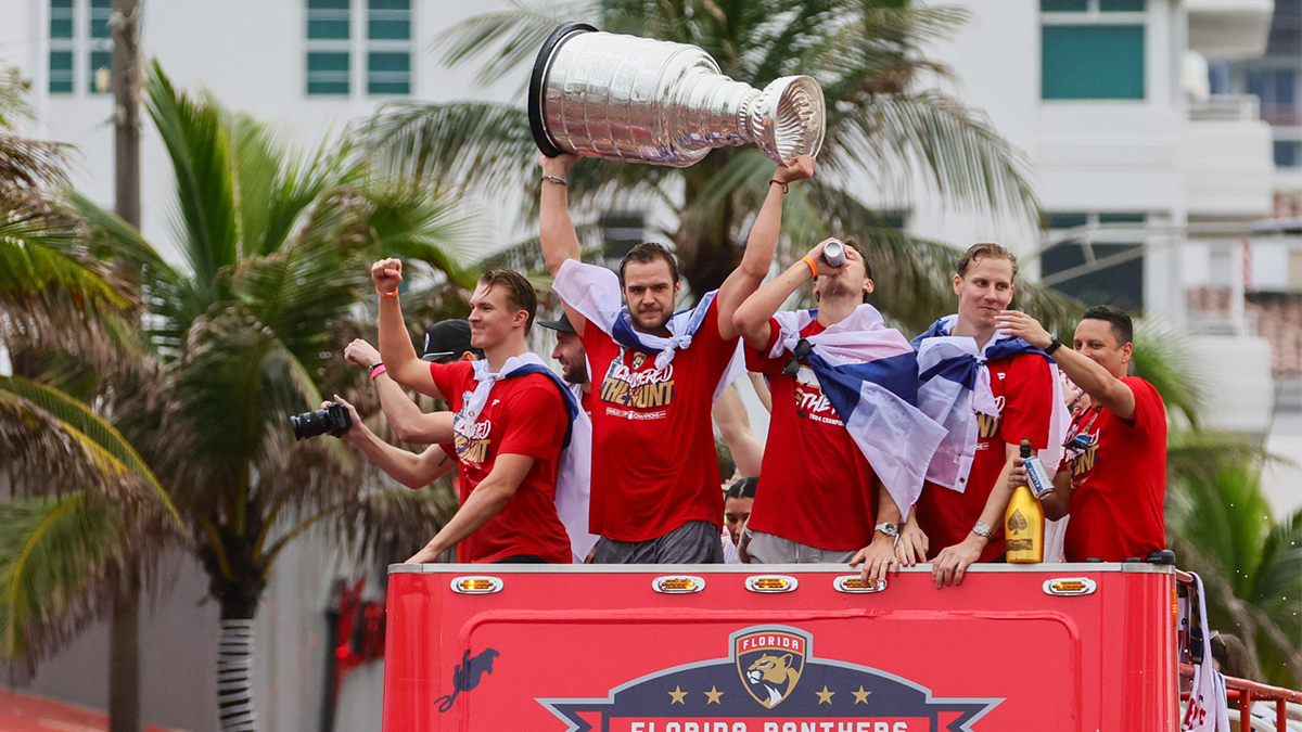Florida Panthers center Aleksander Barkov (center) hoists the cup during the Stanley Cup victory parade and celebration.