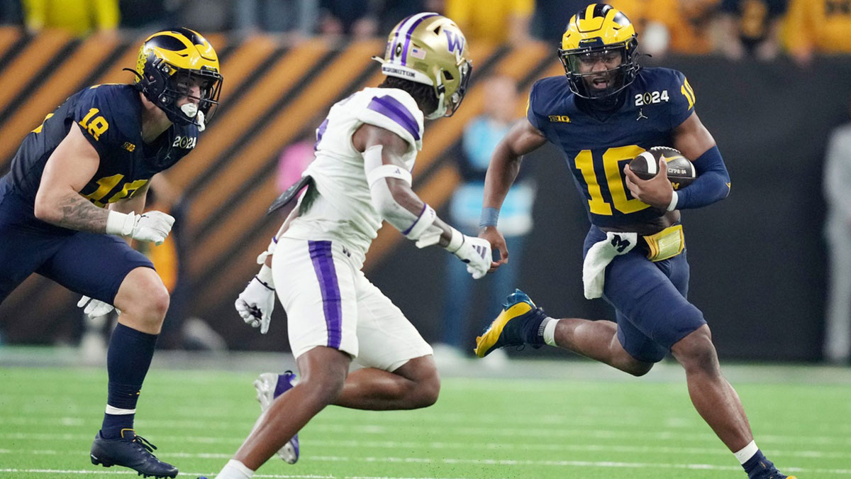 Michigan quarterback Alex Orji runs the ball in the second quarter of the College Football Playoff national championship game against Washington