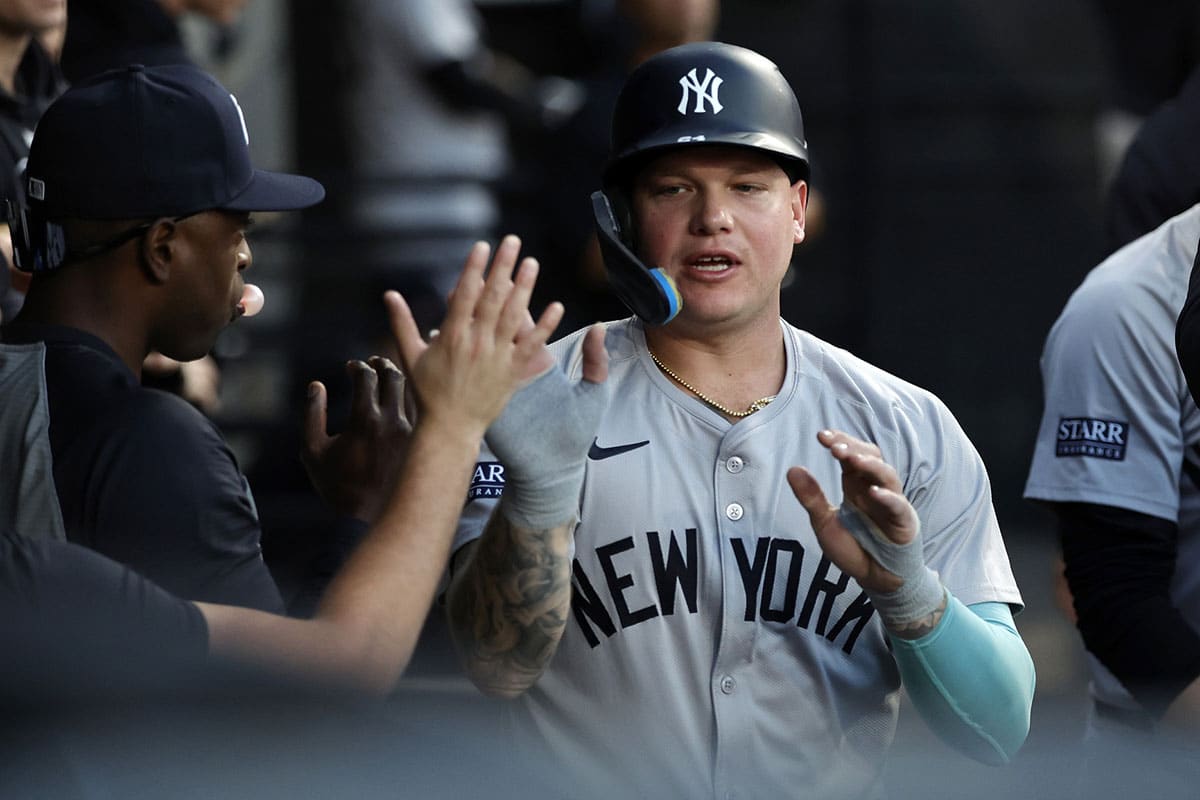 New York Yankees outfielder Alex Verdugo (24) reacts in the dug out after scoring against the Chicago White Sox during the first inning at Guaranteed Rate Field.