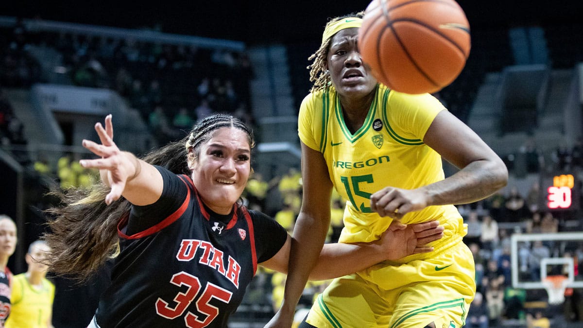 Utah forward Alissa Pili and Oregon center Phillipina Kyei go after a loose ball as the Oregon Ducks host the No. 16 Utah Utes Friday, Jan. 26, 2024 at Matthew Knight Arena in Eugene, Ore.