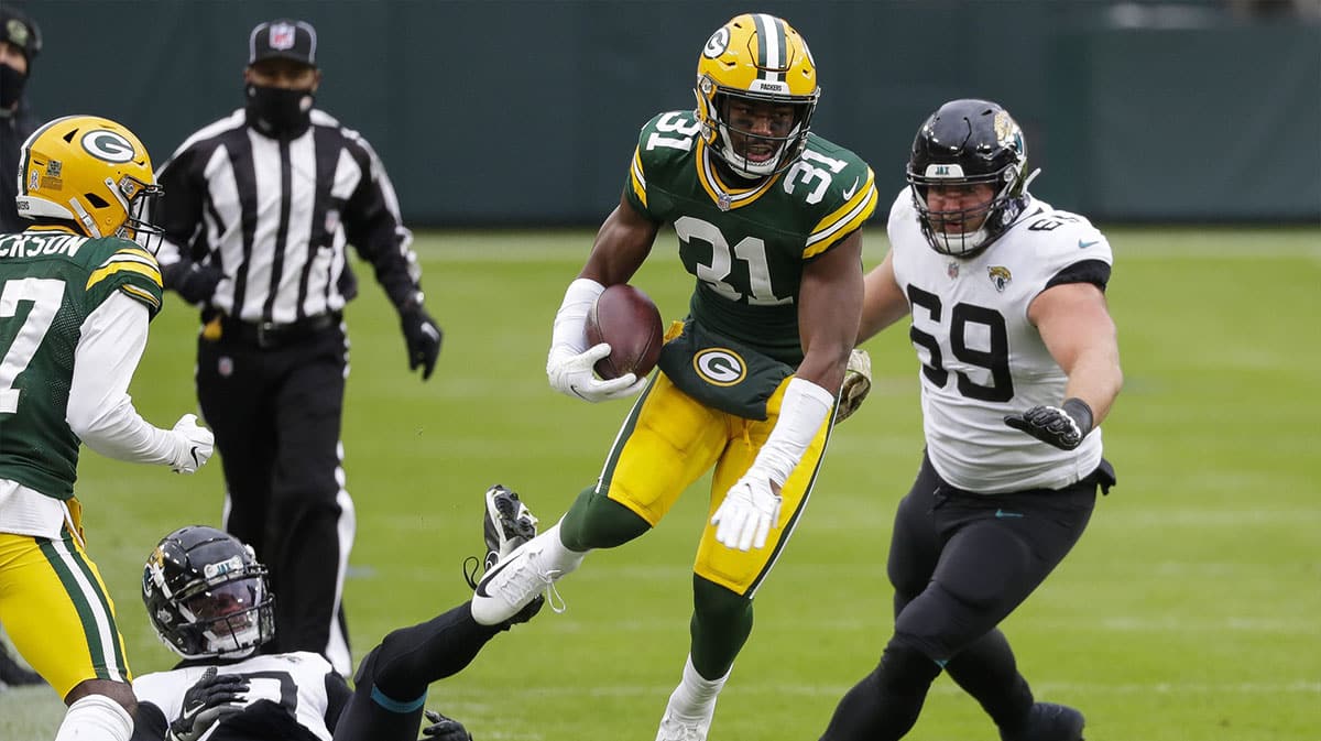 Green Bay Packers safety Adrian Amos (31) returns an interception against the Jacksonville Jaguars during the second quarter of a Week 10 NFL game on Sunday, Nov. 15, 2020, at Lambeau Field in Green Bay, Wis. 
