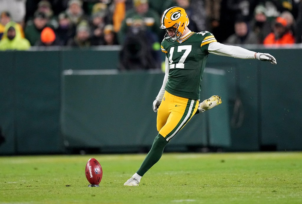 Green Bay Packers place kicker Anders Carlson (17) kicks off during the first quarter of their game against the Kansas City Chiefs Sunday, December 3, 2023 at Lambeau Field in Green Bay, Wisconsin.