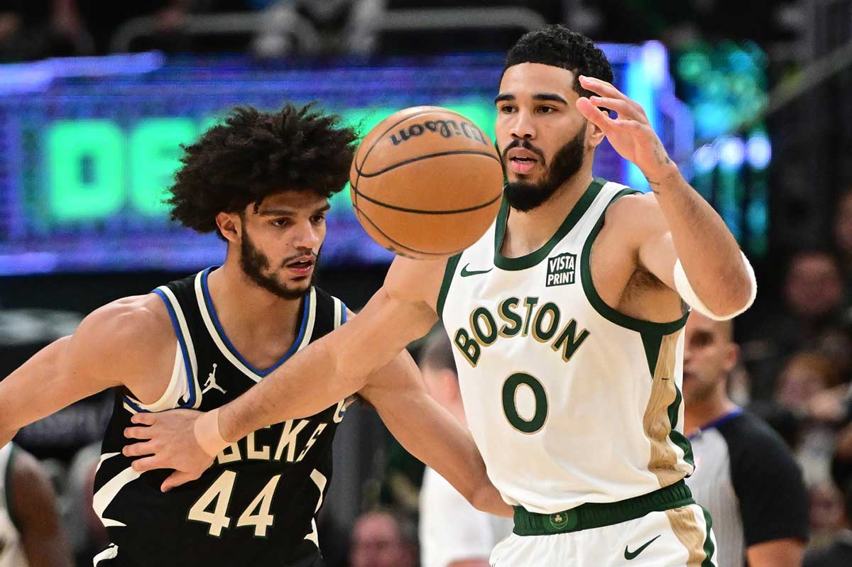  Boston Celtics forward Jayson Tatum (0) passes the ball away from Milwaukee Bucks guard Andre Jackson Jr. (44) in the second quarter at Fiserv Forum.