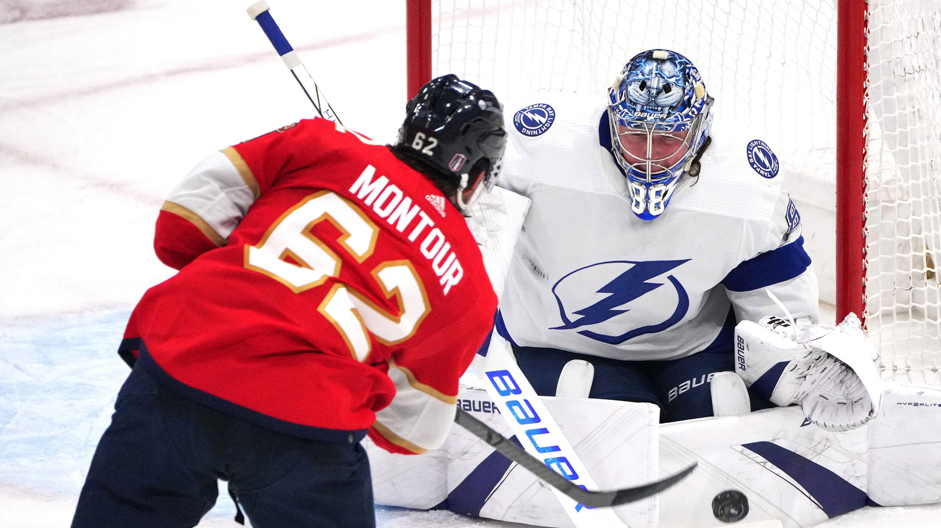 ampa Bay Lightning goaltender Andrei Vasilevskiy (88) makes a save against Florida Panthers defenseman Brandon Montour (62) during the second period in game five of the first round of the 2024 Stanley Cup Playoffs at Amerant Bank Arena.