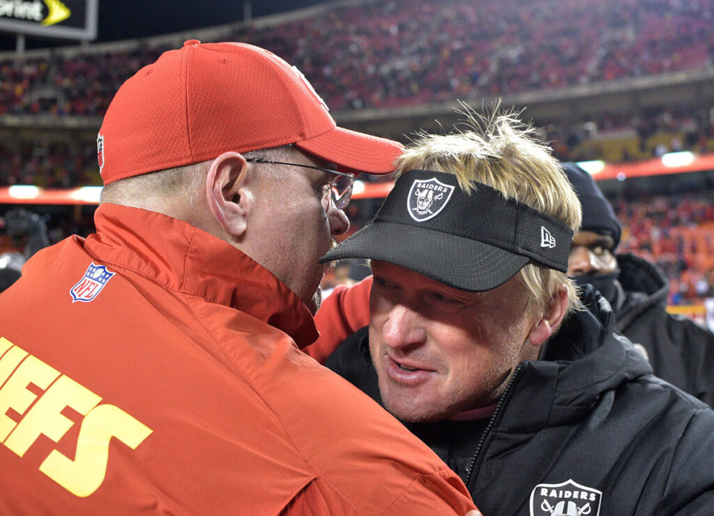 Kansas City Chiefs head coach Andy Reid (left) talks with Oakland Raiders head coach Jon Gruden after the game at Arrowhead Stadium. The Chiefs won 35-3.