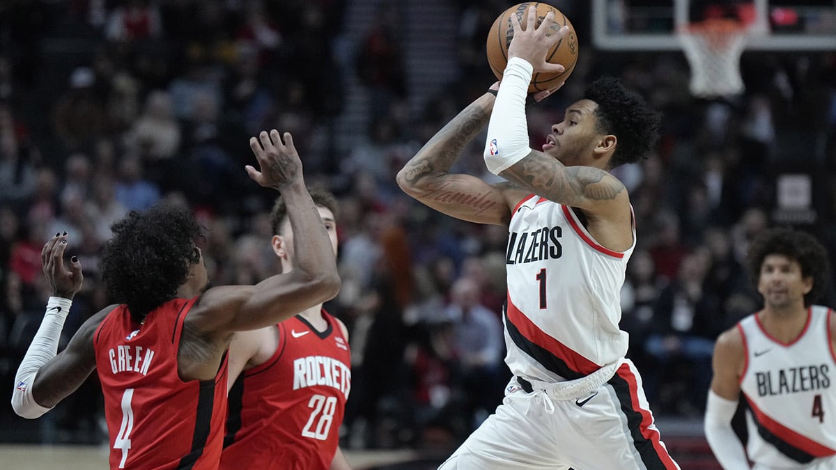 Portland Trail Blazers shooting guard Anfernee Simons (1) is fouled while shooting by Houston Rockets shooting guard Jalen Green (4) during the second half at Moda Center.