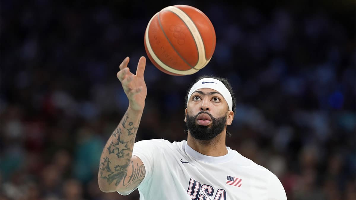 Anthony Davis (14) warms up before a game against Serbia