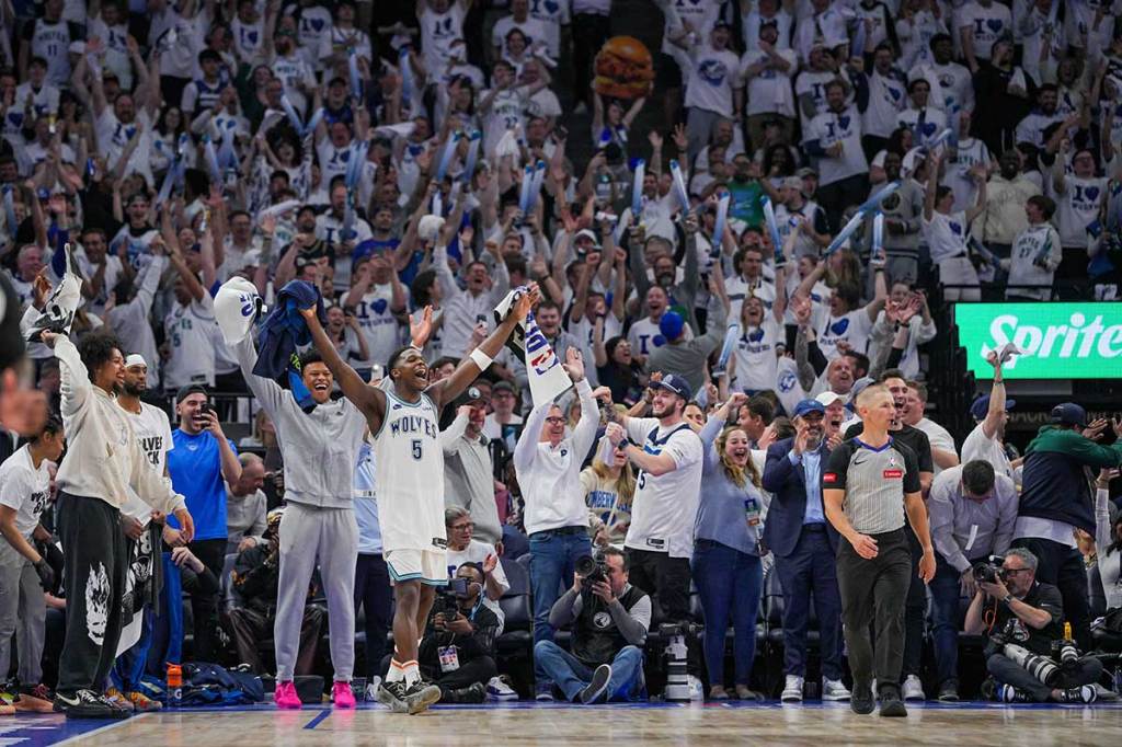 Minnesota Timberwolves guard Anthony Edwards (5) celebrates in the fourth quarter against the Denver Nuggets during game six of the second round for the 2024 NBA playoffs at Target Center.