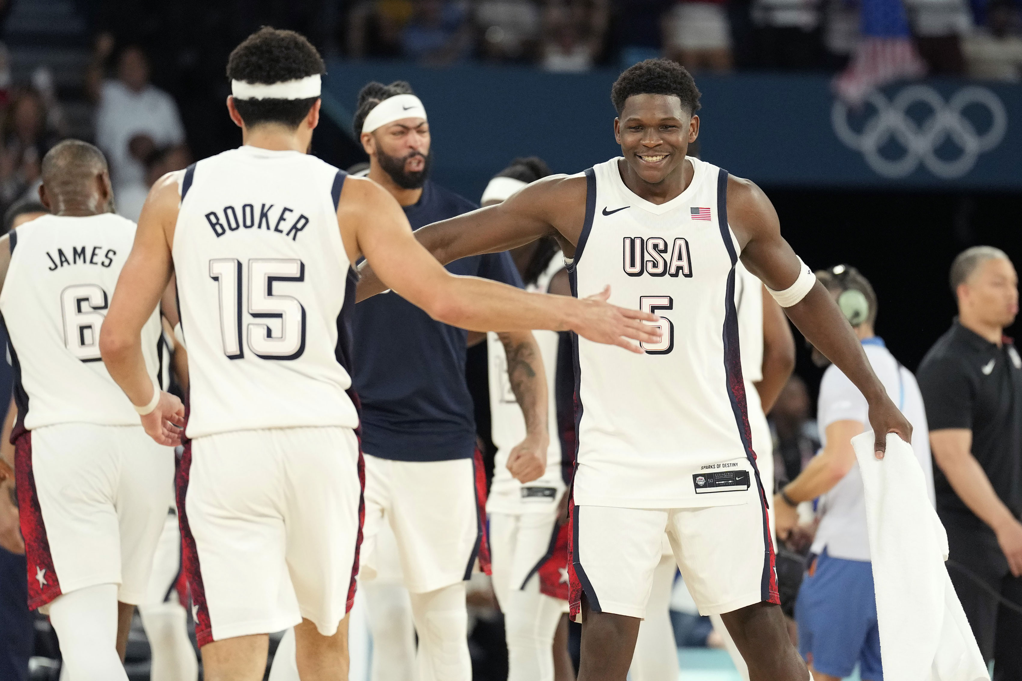 US guards Anthony Edwards (5) and Devin Booker (15) celebrate during the second half against Serbia in the semifinals of men’s basketball at the 2024 Summer Olympics in Paris at the Accor Arena.