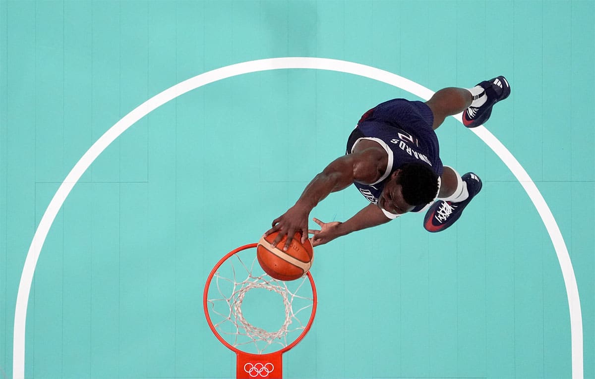 United States guard Anthony Edwards (5) dunks against Puerto Rico during the Paris 2024 Olympic Summer Games at Stade Pierre-Mauroy.